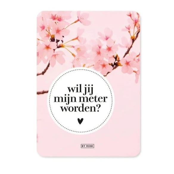 Roze wenskaart met bloesemtakken, afgeronde hoeken en de tekst ‘wil jij mijn meter worden?’ in een witte cirkel.