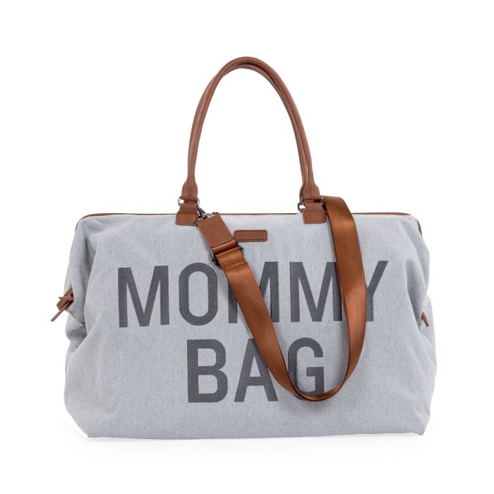 Grijze Mommy Bag verzorgingstas met bruine handvatten en een bruine schouderriem.