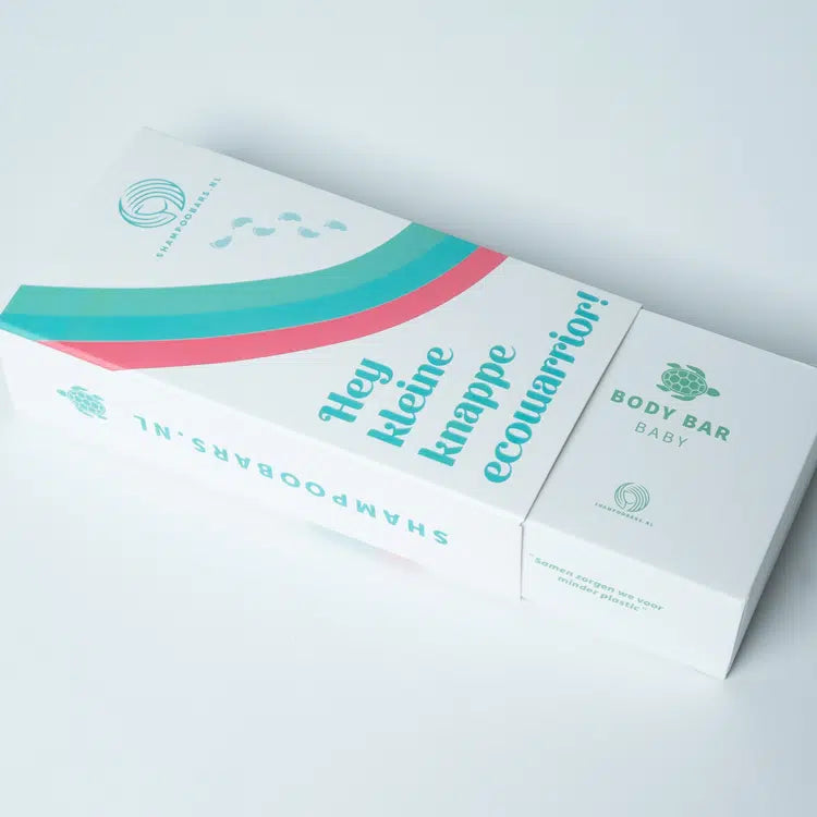 Cadeaudoos voor baby body bar en shampoo bar met turquoise en roze bogen, gedeeltelijk opengeschoven