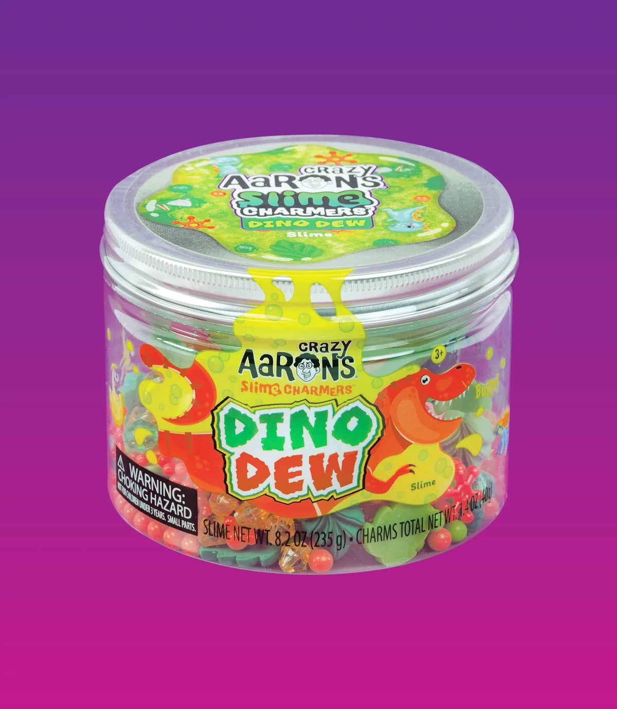 Gesloten pot Crazy Aaron's Slime Charmers Dino Dew met felgroen slijm en een kleurrijk dinosaurus-etiket.
