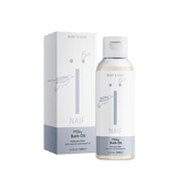 Naïf Milky Badolie voor Baby & Kids in een fles van 100 ml met witte dop, naast de verpakking
